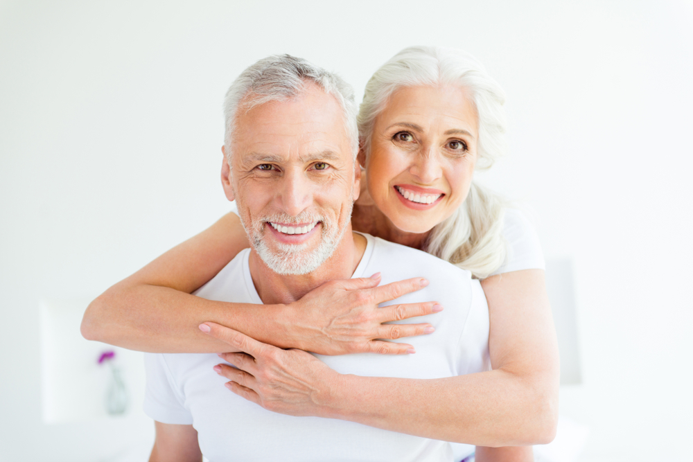 Dental implants couple smiling